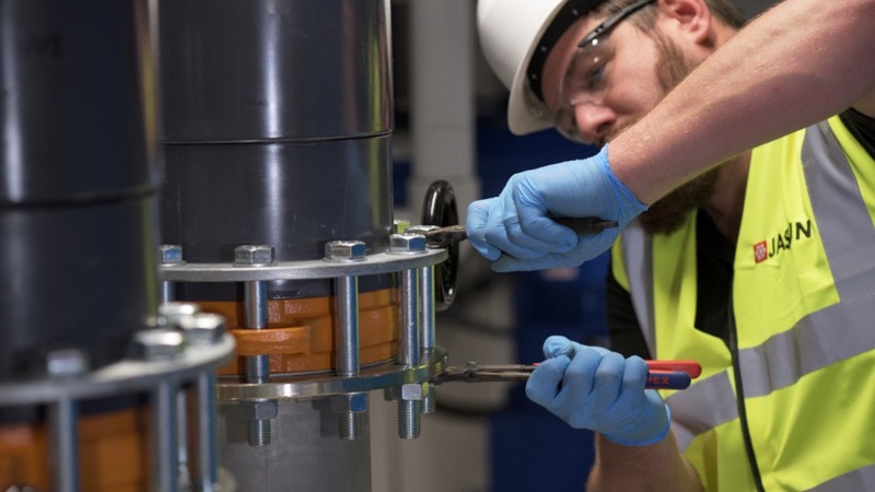 Engineer servicing filtration equipment