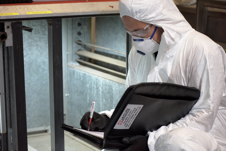 A Jasun technician inspecting a filter section